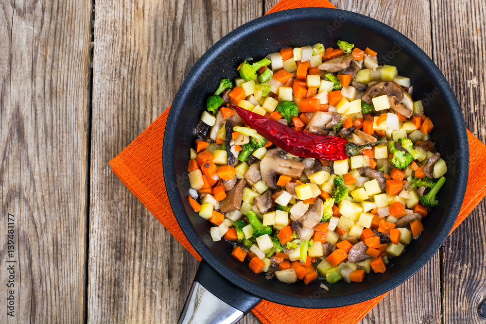 Vegetables with mushrooms, cooked in frying pan Vegetables with mushrooms, cooked in frying pan