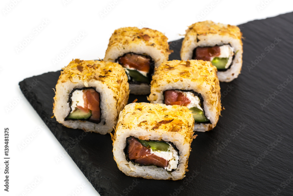 Original sushi rolls on black stone