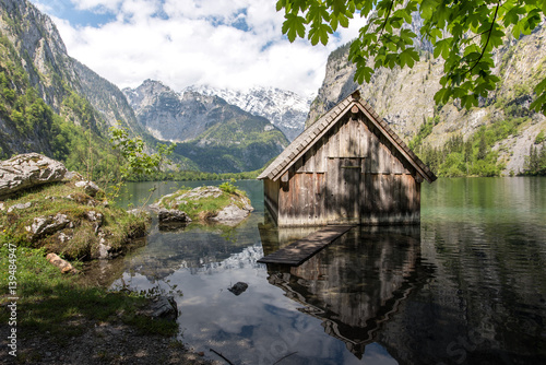 Small boat house in an idyllic mountain lake
