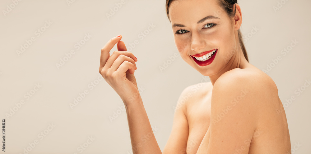 Smiling young woman with perfect skin Smiling young woman with perfect skin