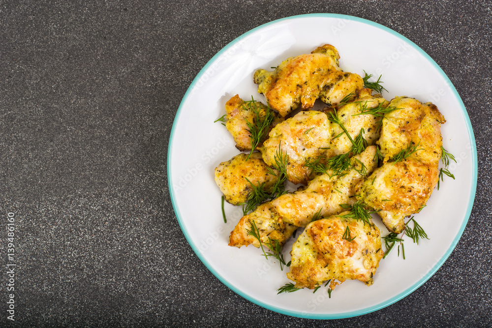 Pieces of fried chicken in breadcrumbs on plate Pieces of fried chicken in breadcrumbs on plate