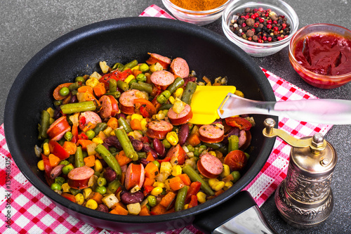 Mexican mix of vegetables with sausages in pan