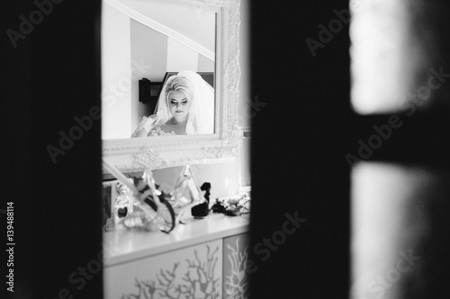 young bride portrait with perfume is getting ready at home in the morning, wedding day