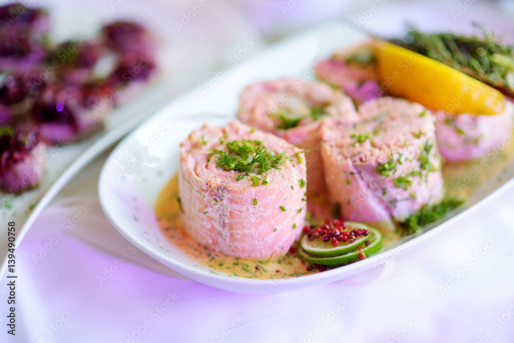 Delicious fish rolls with vegetables served on a party or wedding reception Delicious fish rolls with vegetables served on a party or wedding reception