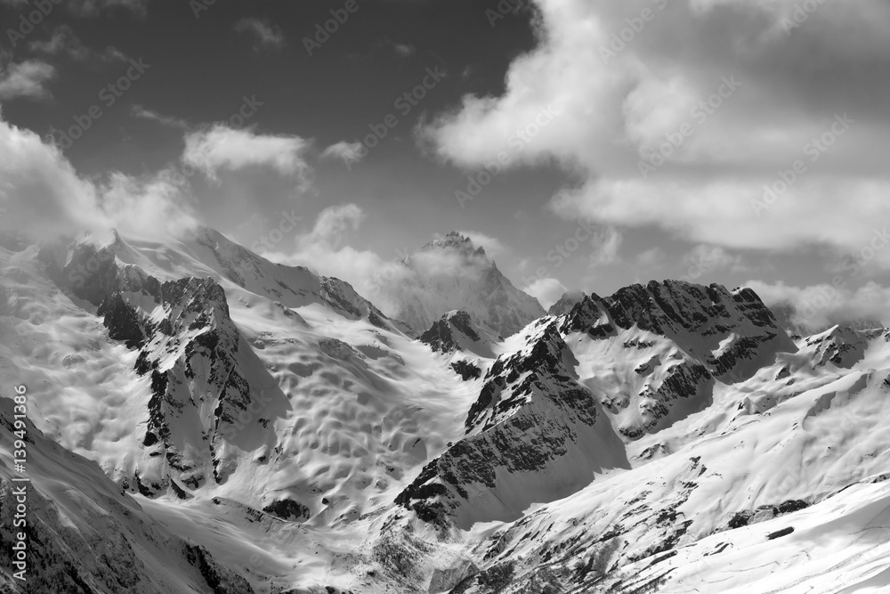 Black and white view on winter mountains in snow