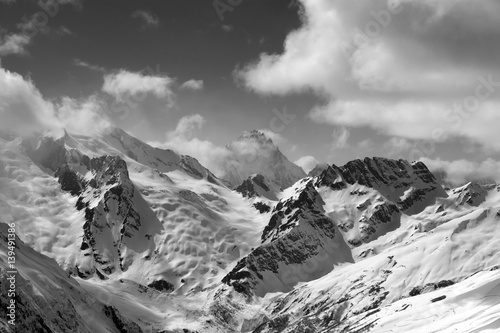 Black and white view on winter mountains in snow