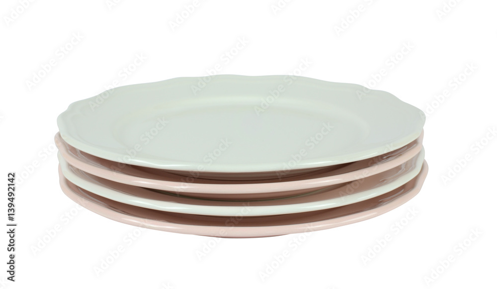 Pile of pink and white fine porcelain plates on white Pile of pink and white fine porcelain plates on white