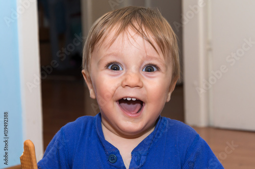 Cute baby is eating snack