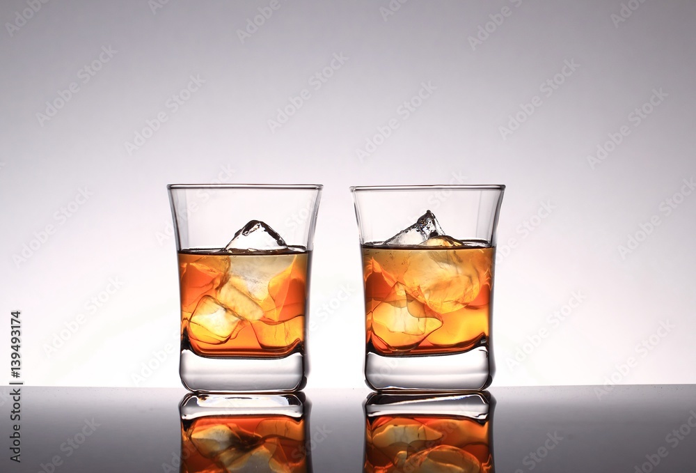 Glasses with whiskey and ice Glasses with whiskey and ice