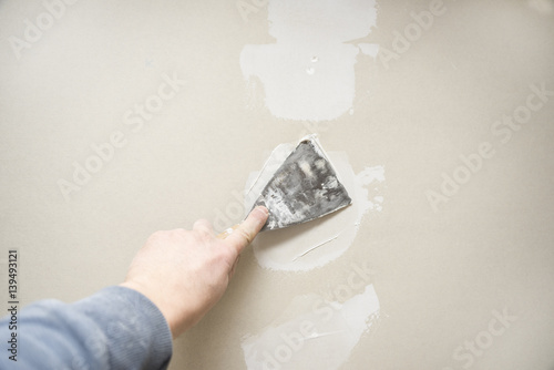 Drywall repair plastering closeup