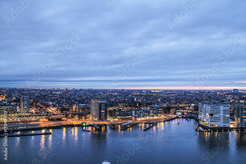 Dusk view over the river on to City of Amsterdam, Netherlands © Ruslans Golenkovs