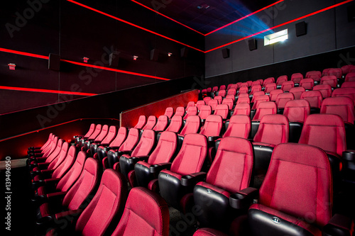 Cinema hall, movie theater, theatre with red armchairs