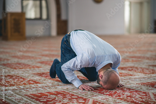 Humble Muslim prostrating in prayer