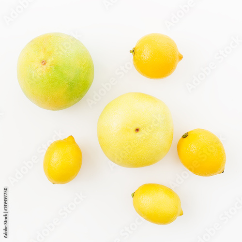 Citrus fruits - lemon, sweetie and pomelo isolated on white background. Flat lay, top view. Summer background