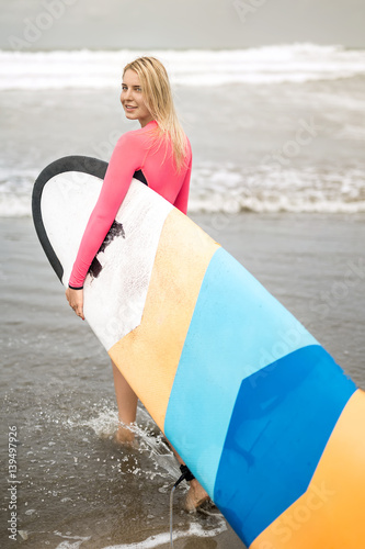 Photography Girl with surfboard on beach