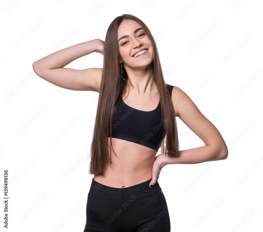 Young smiling fitness-girl in sport style isolated on white background. Healthy lifestyle concept. Young smiling fitness-girl in sport style isolated on white background. Healthy lifestyle concept.