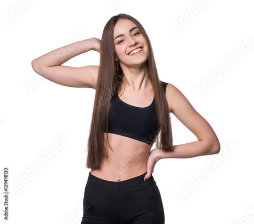 Young smiling fitness-girl in sport style isolated on white background. Healthy lifestyle concept.