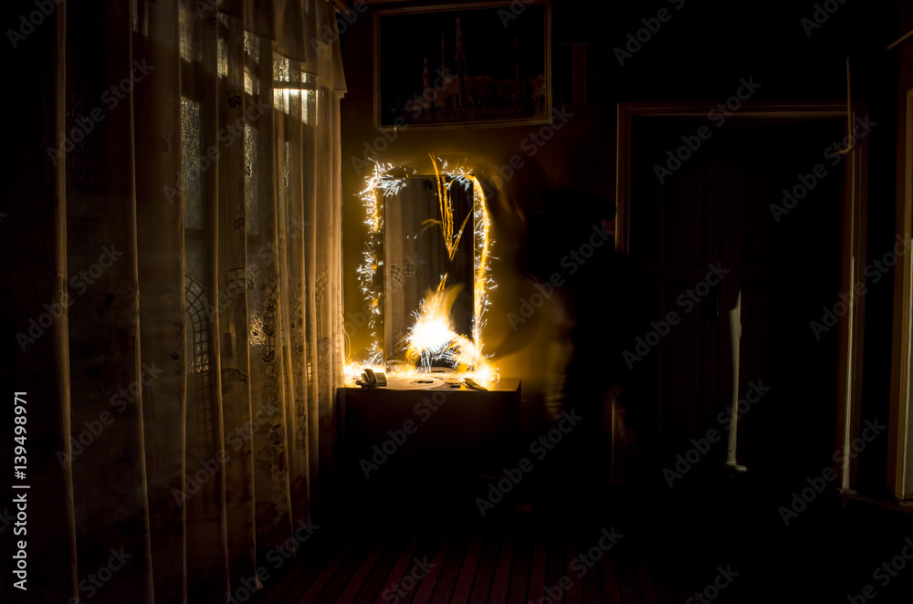 Abstract fireworks flame freezelight on window. Apartment building on Fire at Night time. Fire concept. Azerbaijan