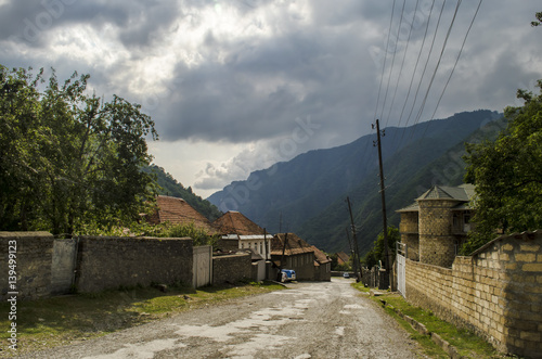 Beautiful summer landscape in mountains, green meadows and the dark blue sky with clouds . Big Caucasus. Azerbaijan photo