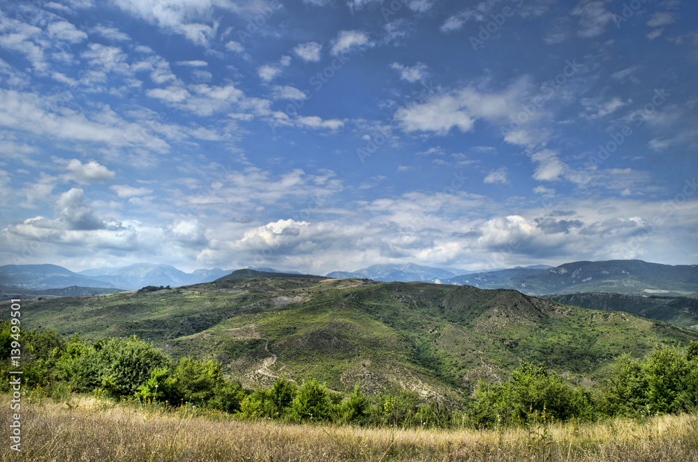 Beautiful summer landscape in mountains, green meadows and the dark blue sky with clouds . Big Caucasus. Azerbaijan