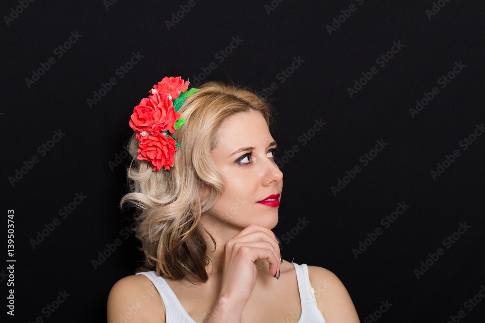Woman with blonde curls in a profile on a dark background closeup Woman with blonde curls in a profile on a dark background closeup