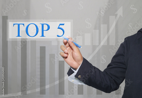 Hand of businessman Write a text of TOP5. photo