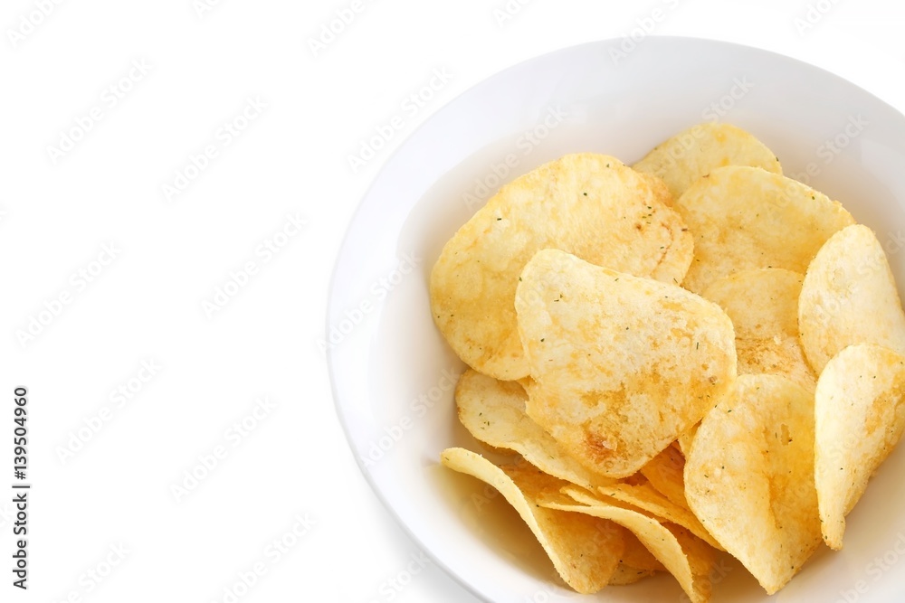 Potato Chips in a White China Bowl on White Background Potato Chips in a White China Bowl on White Background