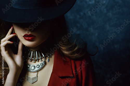 Slika na platnu Indoor portrait of a young beautiful  fashionable woman wearing stylish accessories