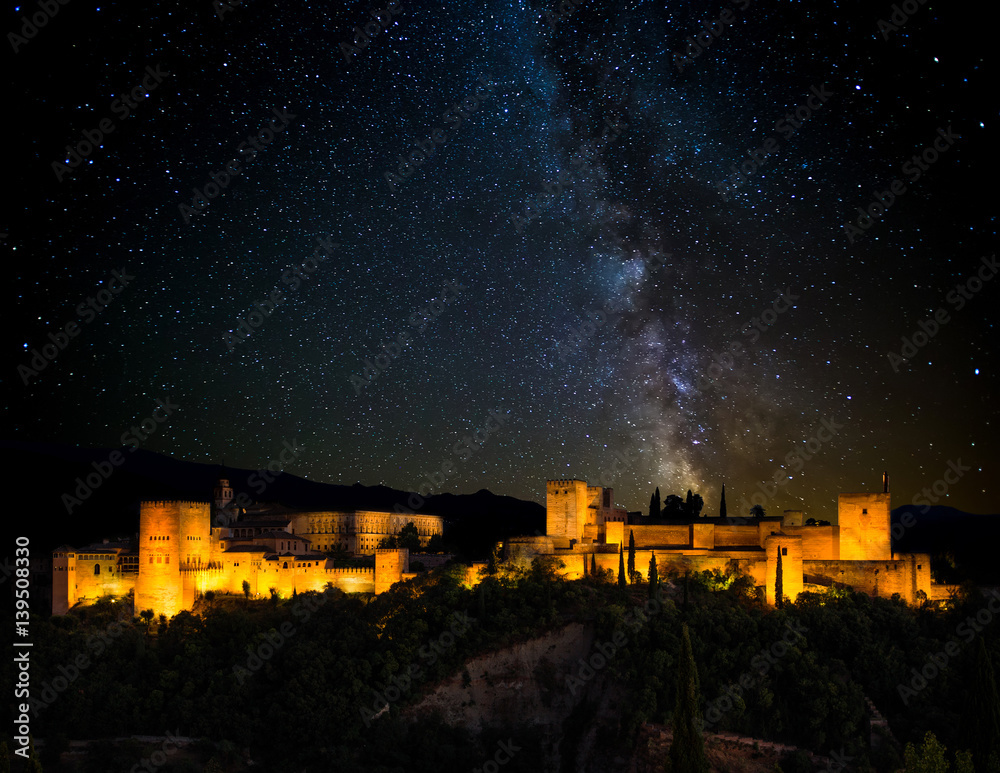 Ancient arabic fortress of Alhambra at night, Milky way. Granada, Spain. - obrazy, fototapety, plakaty 