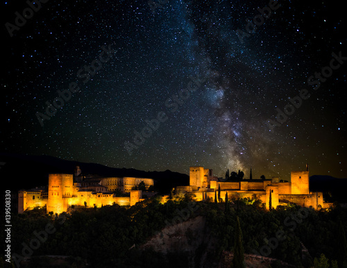 Ancient arabic fortress of Alhambra at night, Milky way. Granada, Spain. photo