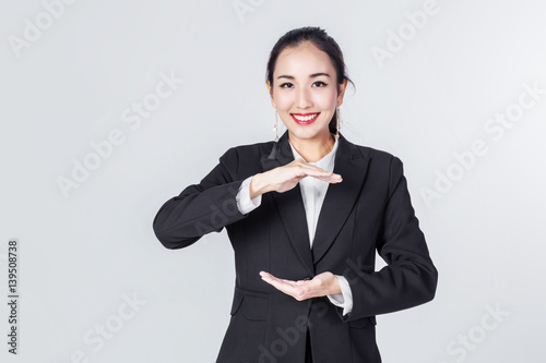 asian business woman smile and show free copyspace for your creativity ideas text