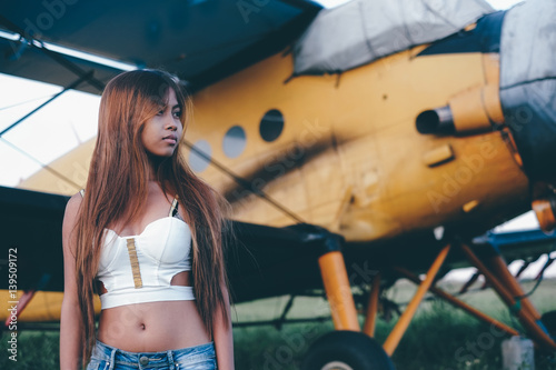 Beautiful female portrait on the airfield