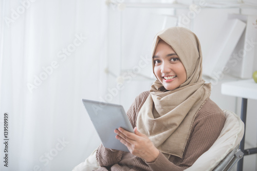 modern asian woman using tablet pc