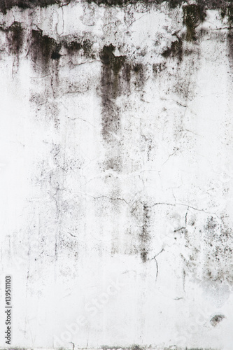 Texture of grey concrete wall with dark water marks running vertically down and many marks and lines © NVB Stocker