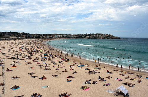Sydney, Australia - Feb 5, 2017. People relaxing, swimming and sun bathing on Bondi beach. Bondi beach is one of the most famous tourist sites in Australia. © katacarix