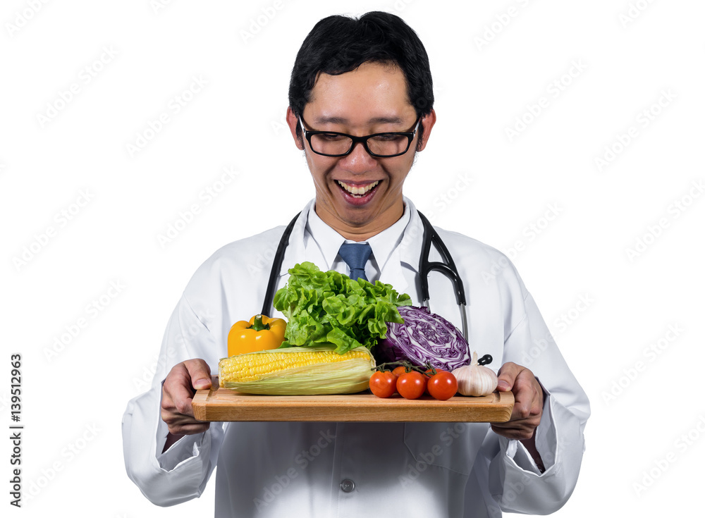 Portrait of beautiful asian young doctor holding the mix fresh vegetables in wooden plate on white background, Healthy food concept Portrait of beautiful asian young doctor holding the mix fresh vegetables in wooden plate on white background, Healthy food concept