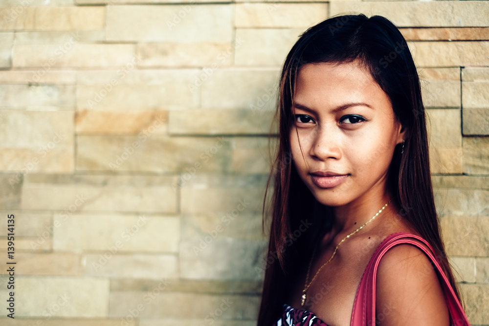 Portrait of beautiful girl on red concrete wall Portrait of beautiful girl on red concrete wall