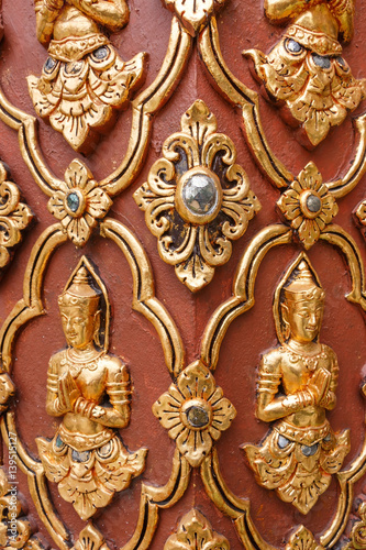 Golden and red traditional Thai carving.