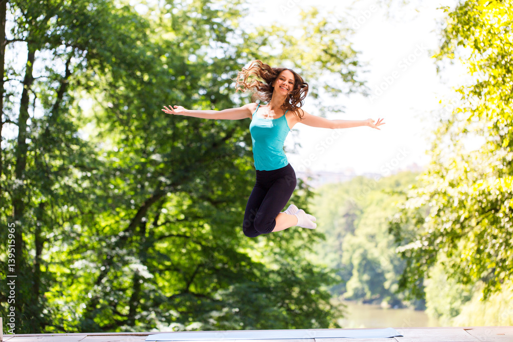 Woman doing exercise outdoors.