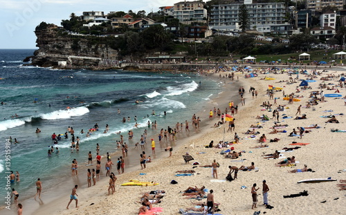 Sydney, Australia - Feb 5, 2017. People relaxing, swimming and sun bathing on Bronte beach. © katacarix