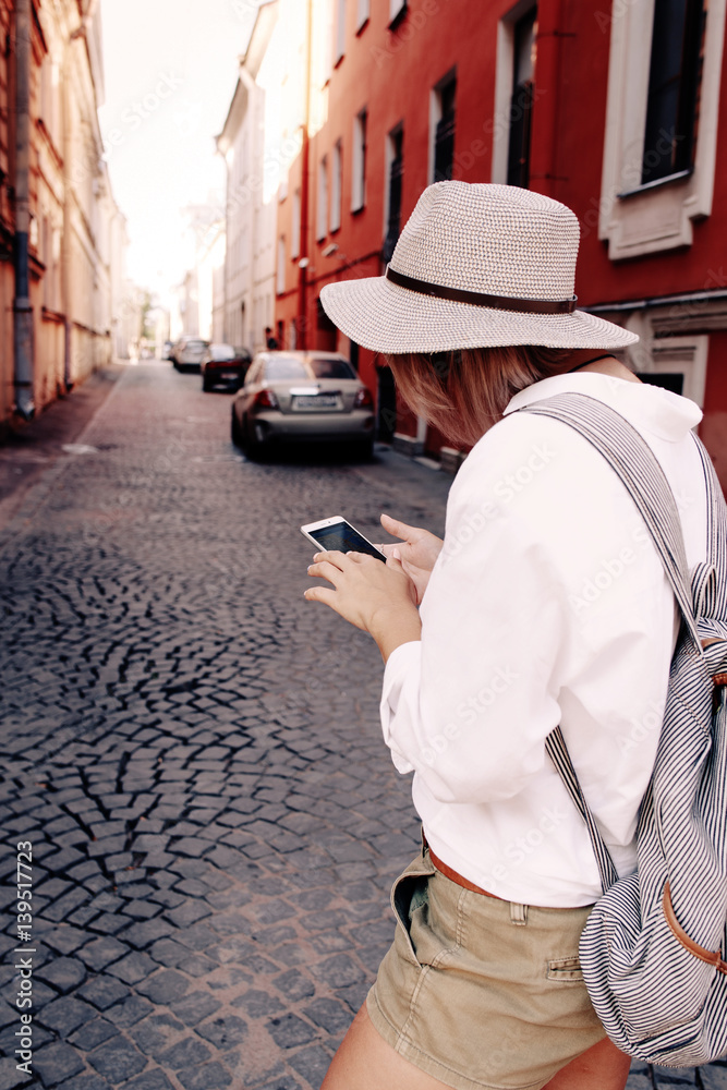 Tourist using navigation app on the mobile phone. Travel concept