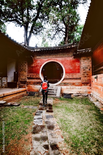 tourist walking in Yunnan Dwellings photo