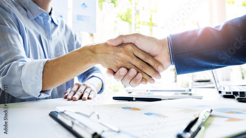 Businessmen shaking hands during a meeting