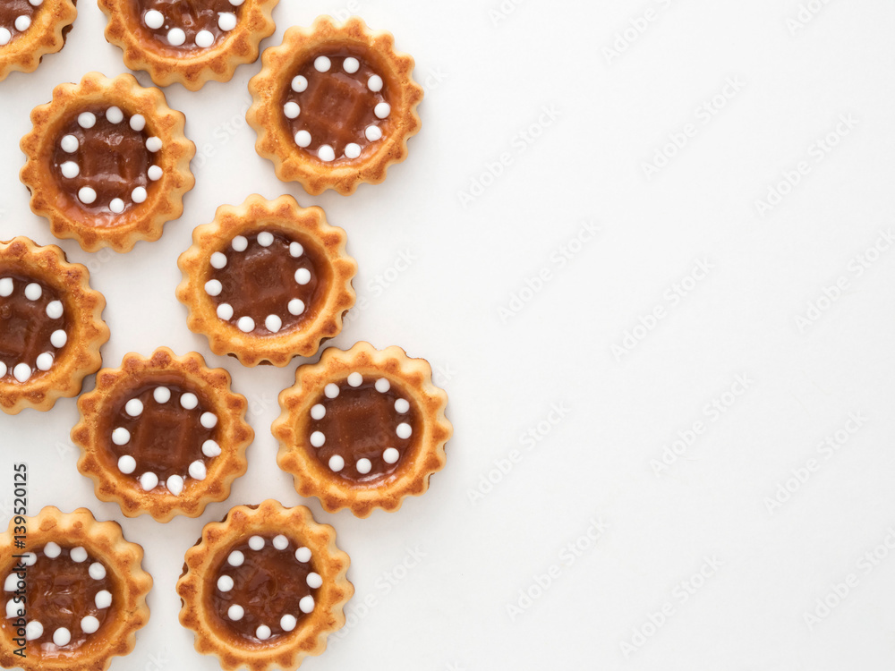 Cookies with caramel on white background top view copyspace Cookies with caramel on white background top view copyspace