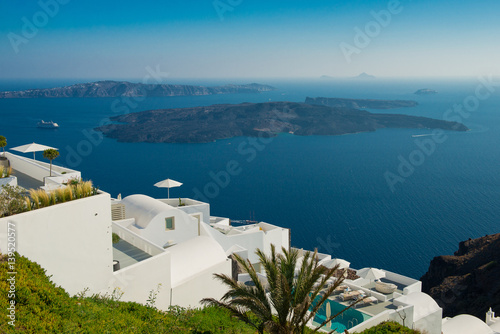 Architecture of island of Santorini, the most romantic island in the world, Greece. Hotels in Santorini. Walking the streets of Fira summer day, Travel to Greece. Beautiful white exterior Santorini