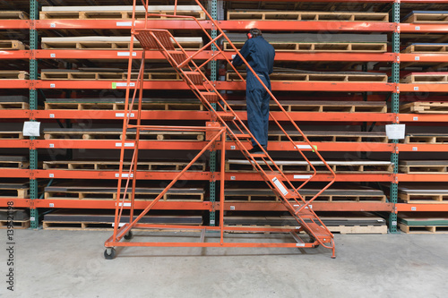 Man on Ladder with Pallet Rack