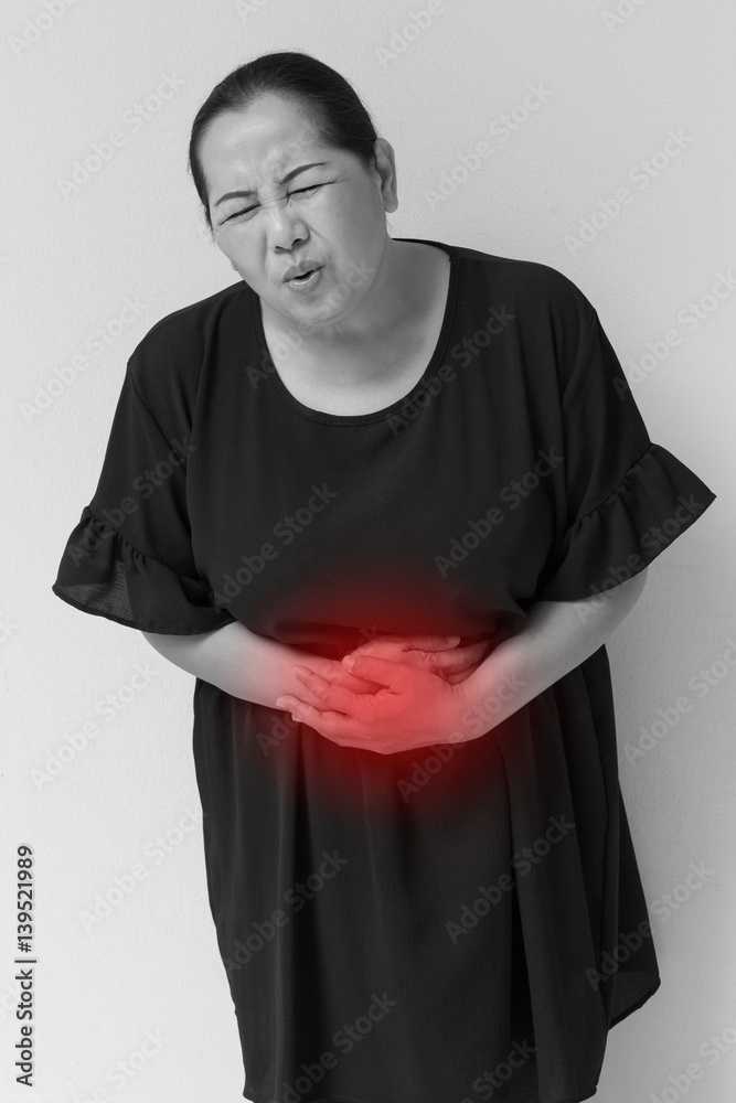 woman suffering from stomach ache, menopause, cramp, food poisoning