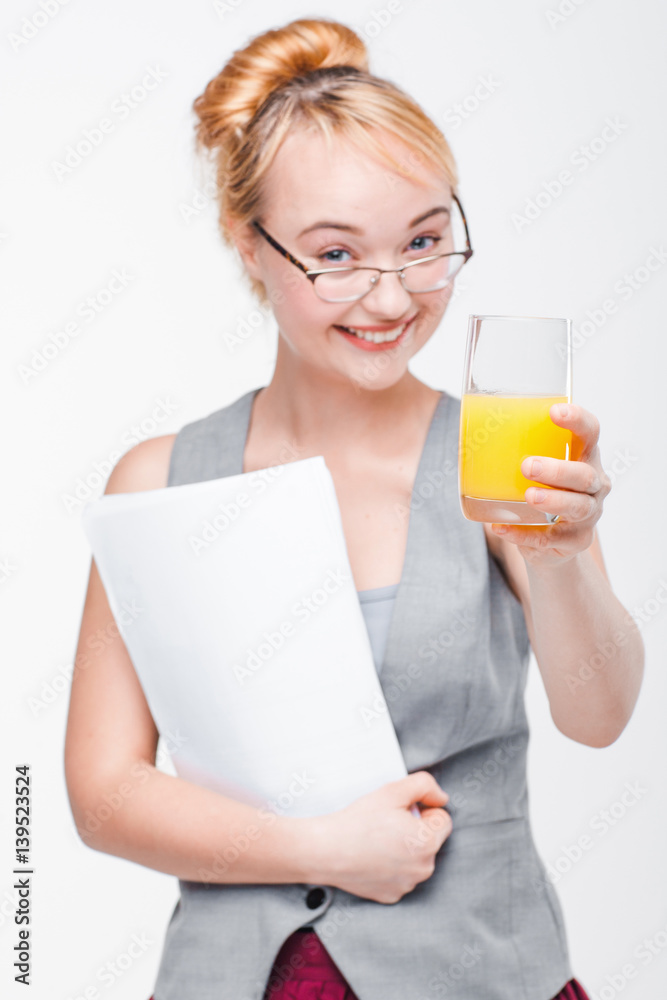 Smiling joyful woman with glass of orange juice feels excited about new diet. Healthy lifestyle concept, grey background. Smiling joyful woman with glass of orange juice feels excited about new diet. Healthy lifestyle concept, grey background.