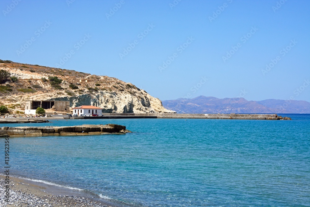 View of the beach and small harbour near Ammoudara, Crete.