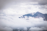 Mountain peak on a cloudy sky. Summer weather in the Peruvian Andes, south of Arequipa. Horizontal image.